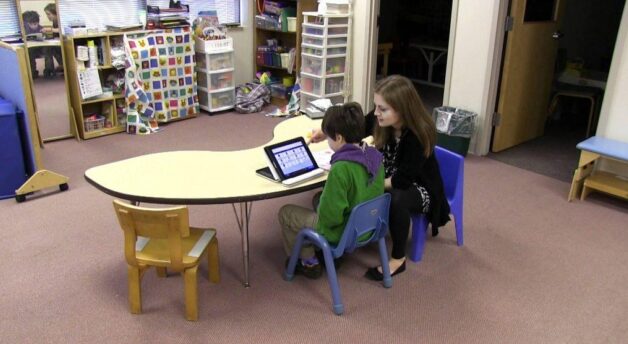 Max and teacher in classroom